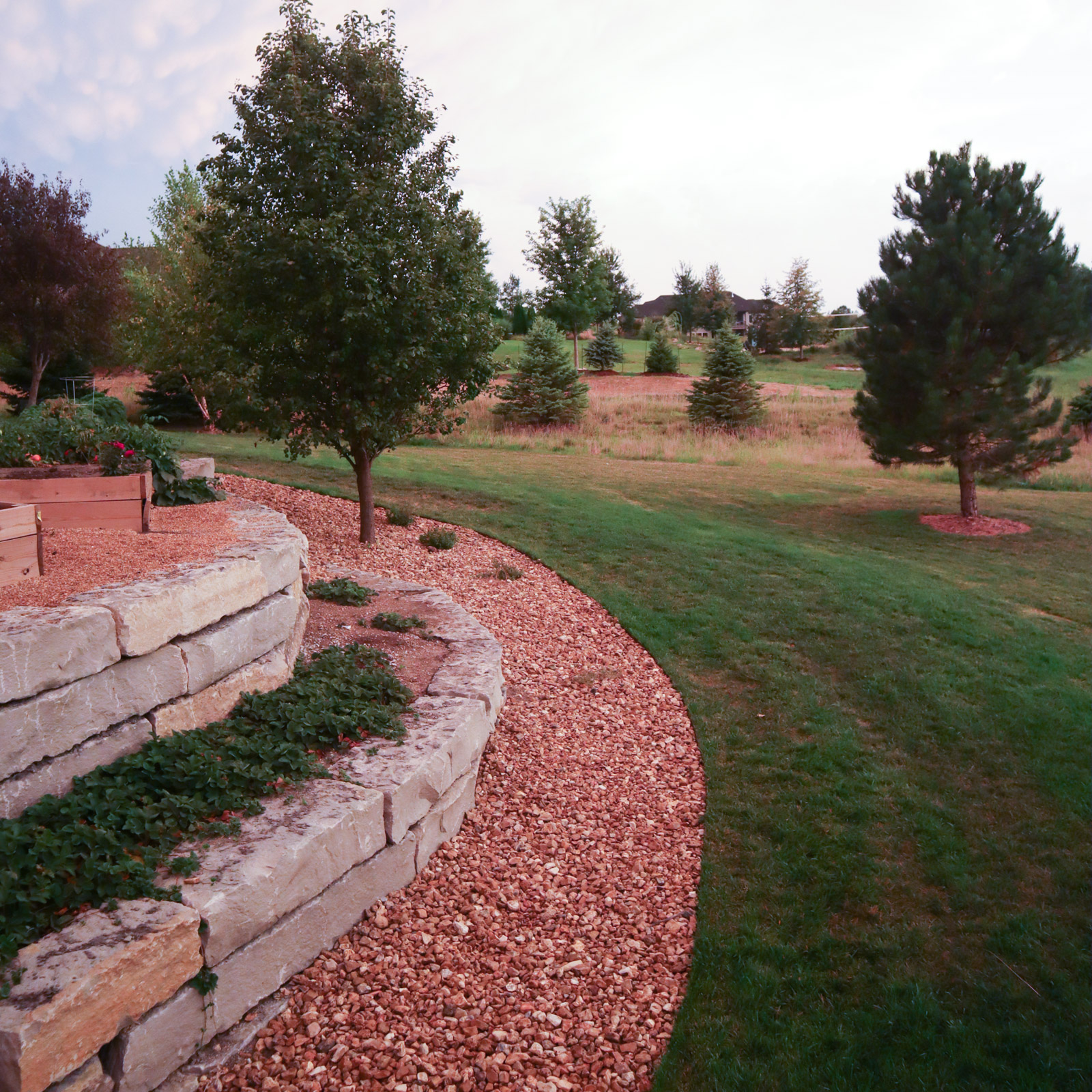 backyard with landscaping from garden rock delivered by tkm materials